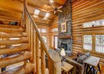 Log stairway to loft and Master Suite